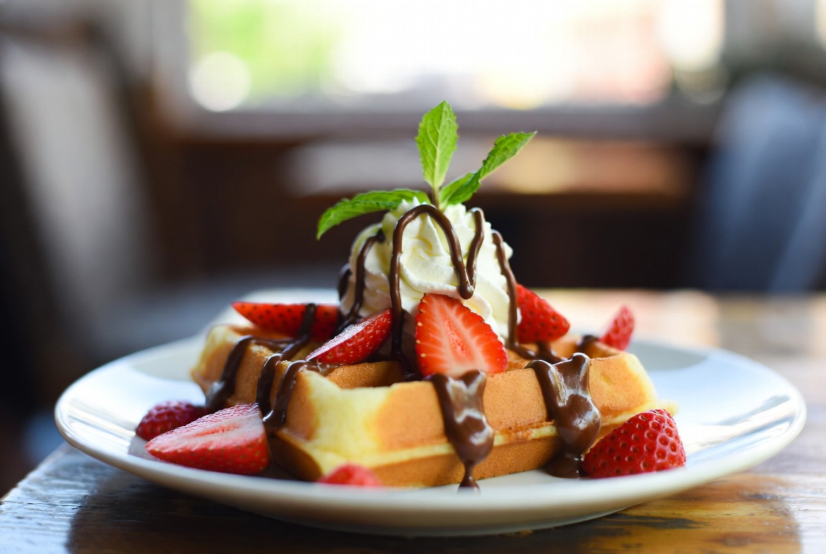Strawberry waffle with cream and chocolate